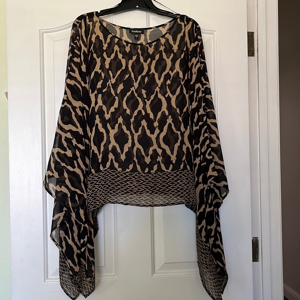 Long sleeve sheer Bebe top.